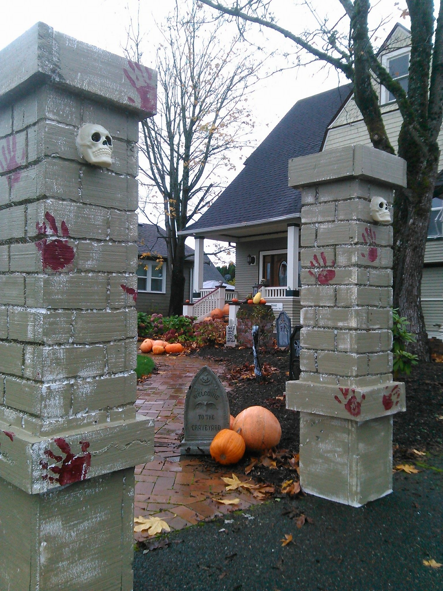 Finished painted foam brick wall Halloween prop with skull display