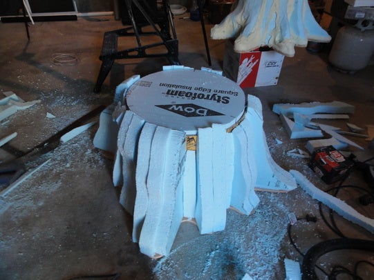 Blue foam insulation pieces glued to the outside of the sonotube shell